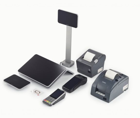 A collection of point-of-sale equipment including a monitor, card readers, thermal receipt printers, a small square device, and a stand with a screen.