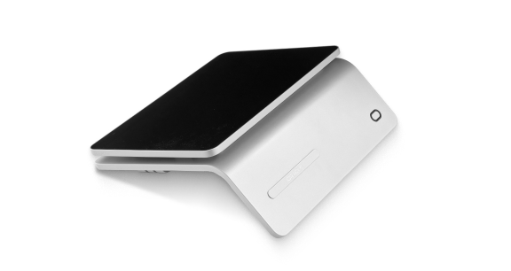 A slim, modern-looking wireless charging pad in a sleek, angular white design with a black charging surface.