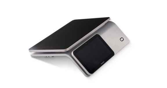 A modern, sleek electronic device with a touchscreen interface, angled and resting on a flat surface, partially open.