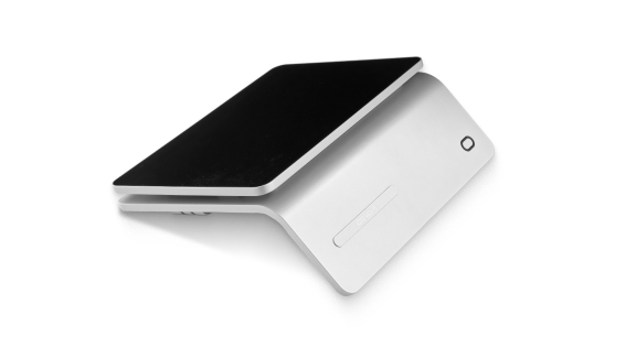 A slim, modern-looking wireless charging pad in a sleek, angular white design with a black charging surface.