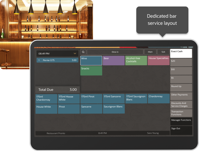 A bar counter with a lighted shelf of liquor bottles in the background and a touchscreen bar service interface displaying various drink order options and total due.
